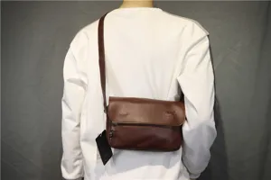 Detail shot showing the vintage brown PU leather crossbody flap bag worn by a model.