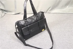 Black PU leather business briefcase detail showing front dual pockets and metal plate.