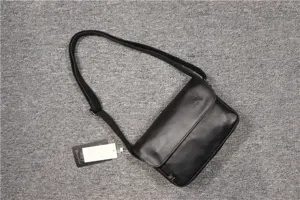 Detailed view of the Three-box minimalist flap men's shoulder bag in retro Japanese style.