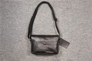 Black leather messenger bag for men, stylish retro flap shoulder bag with adjustable strap.