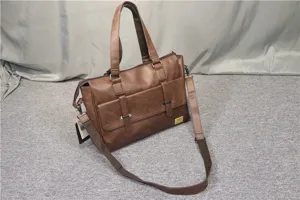 Close-up detail of the brown PU leather business messenger bag, showing texture and pocket.