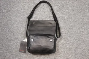 Minimalist black flap messenger bag for men and women, retro casual crossbody shoulder bag.