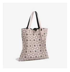 Geometric lattice tote bag minimalist pink shoulder bag stylish casual designer handbag detail.