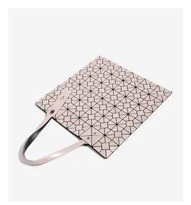 Detail view of the fashionable geometric lattice shoulder bag in pale pink, showing unique panel texture.