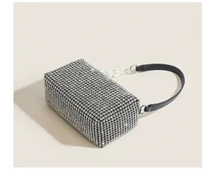 Sparkling rhinestone evening bag with black strap and pearl charm, exquisite party clutch.