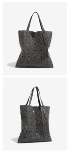 Dark grey geometric lattice tote bag for women, stylish large capacity shoulder bag style.