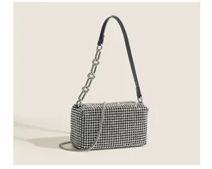 Detailed view of a sparkling rhinestone crystal evening shoulder bag with a stylish chain strap.