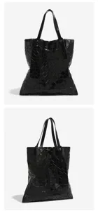 Black geometric panel tote bag, foldable lattice shoulder bag, chic minimalist design.