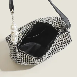 Stunning rhinestone evening shoulder bag with crystals, black strap and elegant pearl charm.