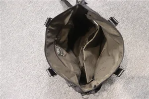 Men's business casual handbag interior detail showing multi-compartment design and ample storage.