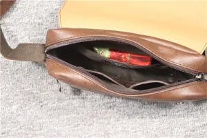 Detailed view of the interior structure of the vintage brown men's leather shoulder bag.