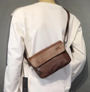 Stylish retro brown messenger bag for men, premium flap crossbody bag for daily use.