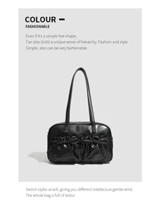 Stylish black shoulder bowling bag with double front pockets and cute bow decoration detail.