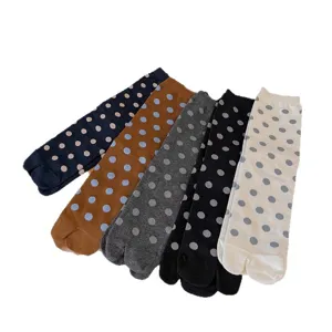 Comfortable cotton split-toe socks with stylish polka dot design, mid-calf length, perfect for daily wear.