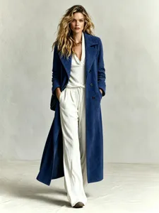 Elegant long blue suede coat paired with white trousers, perfect for chic commute style.