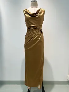 Stunning gold cowl neck sleeveless dress detail featuring elegant side slit and slim fit.