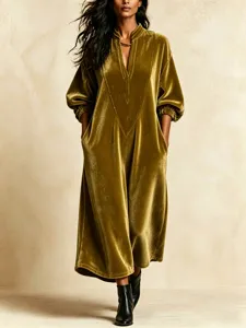 Detailed view of the elegant velvet V-neck long dress featuring chic lantern sleeves and pockets.