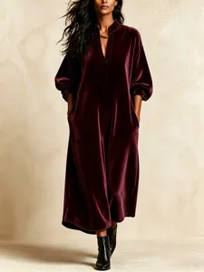 Velvet long dress detail showing v-neckline and elegant lantern sleeves for women.