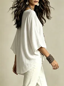Detail view of women's casual loose cotton linen top with V-neck and three-quarter sleeves.