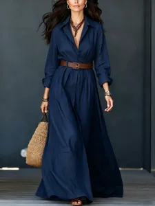 Detail shot of women's long-sleeve maxi shirt dress with belt, cotton-linen texture.