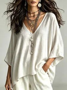 Women's V-neck 3/4 sleeve loose cotton linen casual top detail view with layered necklaces.