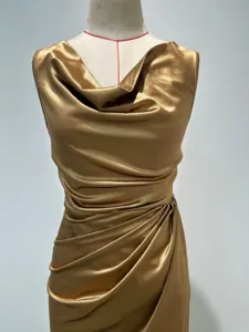 Gold cowl neck sleeveless dress detail, elegant satin slim banquet evening party gown features.