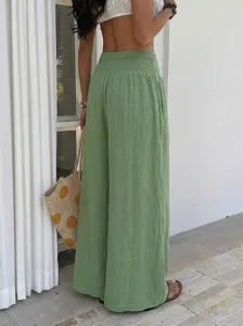 Detail view of high-waisted green wide-leg casual pants showcasing comfortable lifestyle.