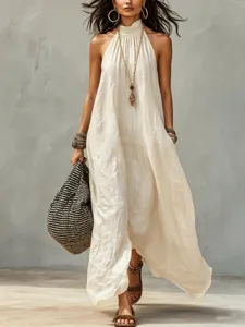 Bohemian style halter maxi dress detail showing textured fabric and stylish accessories.