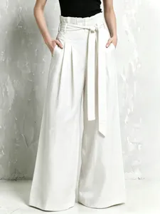 High waist linen wide-leg pants detail, featuring paperbag waist and stylish self-tie belt.