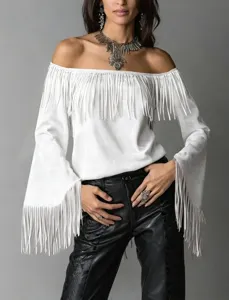 Detailed close-up showing the stylish white off-shoulder fringe top and flared sleeves.