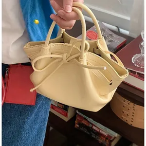 Sac seau jaune chic pour femme, sac à main tendance en cuir avec un joli nœud papillon.