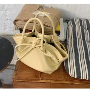 Femme seau minimaliste jaune pale avec poignee noeud sac a main decontracte bandouliere chic