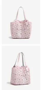 Pink geometric tote bag detail view, showing triangular panel design and double top handles.