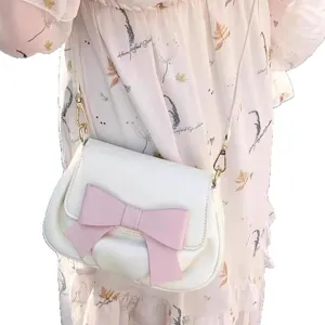 Sweet white crossbody bag featuring a charming pink bow, perfect chic saddle bag for daily.