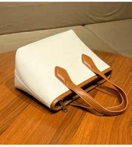 White litchi pattern bucket bag with brown handles, commuter style handbag for women.
