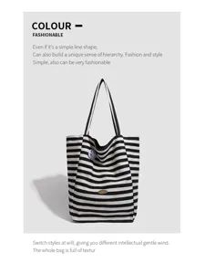 Black and white striped canvas tote bag detail view, casual large capacity daily commuting.