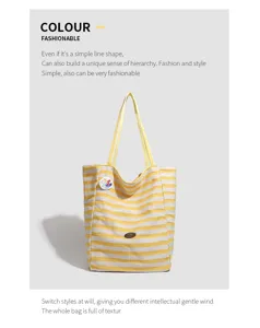 Yellow and white striped canvas tote bag featuring a cute bear badge and durable handles.