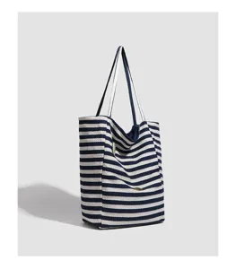 Casual striped canvas shoulder tote bag featuring large capacity for daily commuting use.