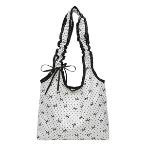 Cute black and white polka dot canvas shoulder bag with sweet ruffles and bow ribbon.