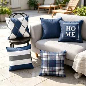 Outdoor waterproof throw pillow covers in blue geometric and plaid patterns, set scene.
