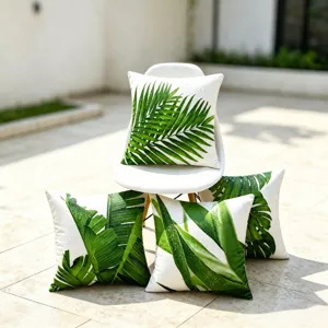 Outdoor waterproof throw pillow covers with green tropical palm leaf print, 4-pack set for patio.