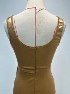 Back view detail of the sleeveless slim evening dress showing zipper and fabric texture.