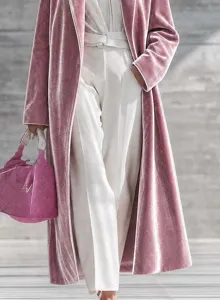 Pink velvet long coat detail showcasing premium fabric texture, elegant lapel, and sophisticated style.