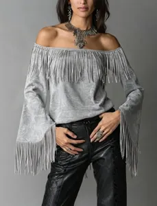 Detail view of the vintage off-shoulder fringe top showcasing suede fabric and long sleeves.
