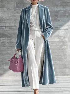 Elegant women long velvet coat in grey blue with lapel, perfect for winter fashion styling.