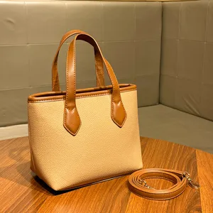 Stylish women commuter handbag litchi grain bucket bag versatile top handle shoulder bag.