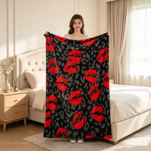 Soft flannel throw blanket with red lips and leopard print for cozy bed and couch home decor.