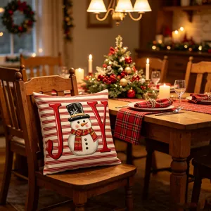 Detailed view of the Christmas snowman decorative throw pillow cover with festive red stripes.