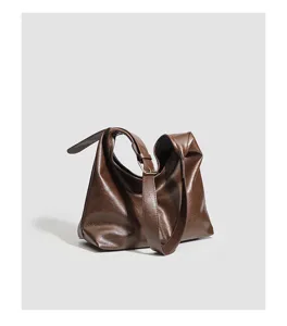 Brown vintage soft leather shoulder bag detail shot, daily casual commute hobo bag.