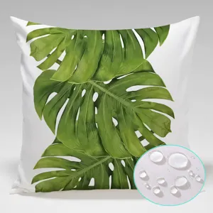 Waterproof monstera leaf throw pillow detail showing water resistant fabric with droplets.